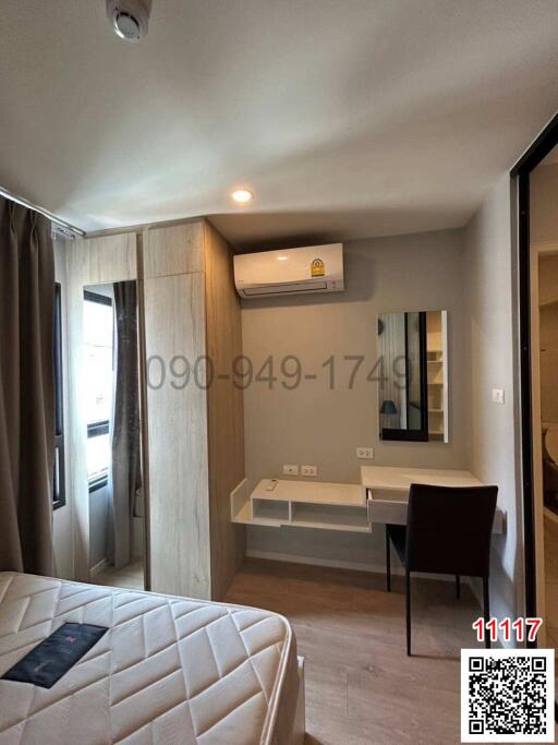 Modern bedroom with large bed, air conditioning, and ample lighting