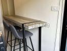 Compact kitchen counter with bar stools