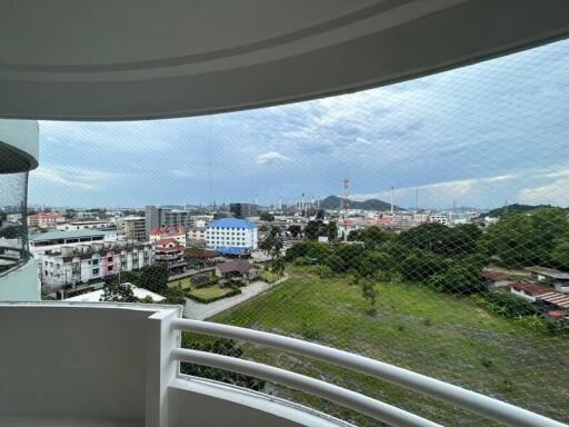 Panoramic view from balcony overlooking the city with protective netting