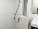 Modern Bathroom with Wall-mounted Shower and White Tiles