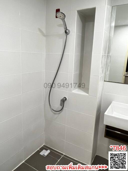 Modern Bathroom with Wall-mounted Shower and White Tiles