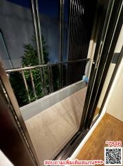 Compact balcony with safety railing at night