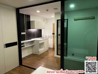 Modern apartment interior with kitchen and glass partition