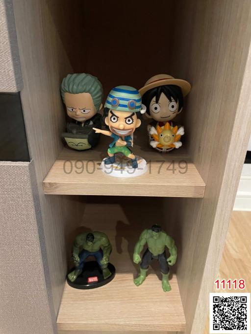 Collection of figurines displayed on shelves