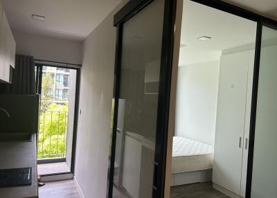 Bright and well-ventilated modern bedroom with sliding door wardrobe and a view to the outside
