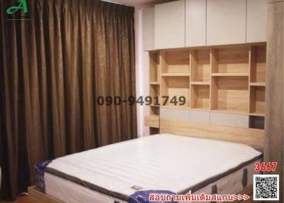 Spacious bedroom with a large bed and built-in shelving units