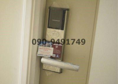 Unfocused image of a small niche with some pamphlets and an electronic device inside a building