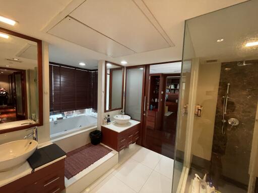 Spacious modern bathroom with bathtub and separate shower