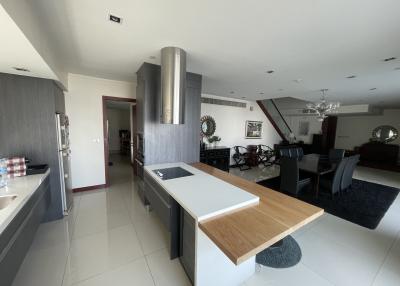 Modern kitchen with open layout leading to the dining area