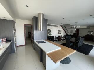 Modern kitchen with open layout leading to the dining area