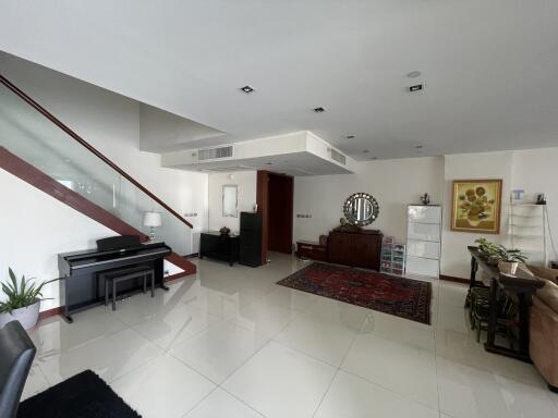 Spacious living room with modern design and abundant natural light
