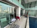 Spacious balcony with city view and a private pool