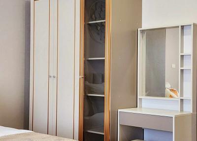 Modern bedroom interior with wardrobe and shelving
