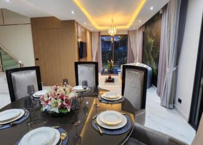 Elegant dining area with a modern table setting and ambient lighting