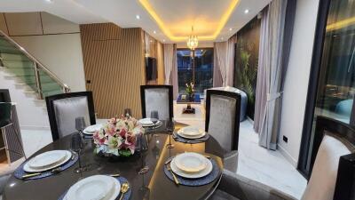 Elegant dining area with a modern table setting and ambient lighting