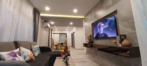 Modern living room with sleek design and entertainment setup