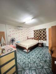 Cozy bedroom with patterned tiles and traditional furnishings