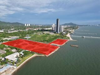 Aerial view of coastal real estate property with marked boundaries