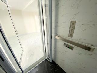 Modern elevator interior with marble walls and sleek design