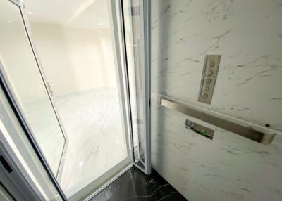 Modern elevator interior with marble walls and sleek design