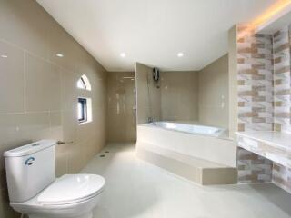 Modern spacious bathroom with bathtub and walk-in shower
