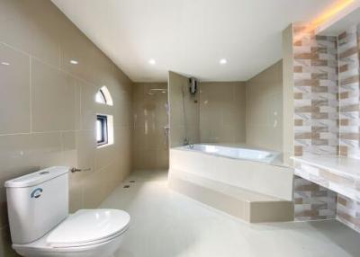 Modern spacious bathroom with bathtub and walk-in shower