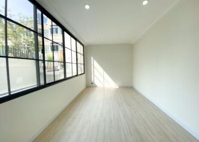 Spacious and well-lit empty living room with large windows