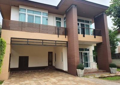 Modern two-story house with spacious garage and balcony