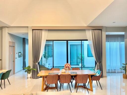 Spacious dining room with modern furniture and natural light