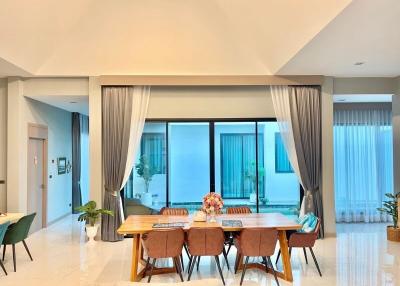 Spacious dining room with modern furniture and natural light