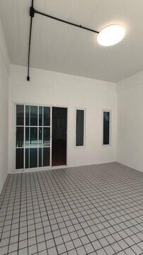 Spacious empty room with checkered floor and large windows