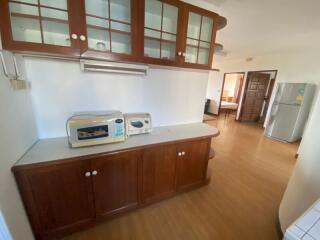 Spacious kitchen with wooden cabinetry and modern appliances