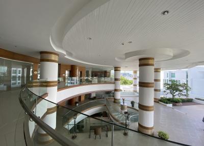 Modern building lobby with sweeping curved balcony and elegant design