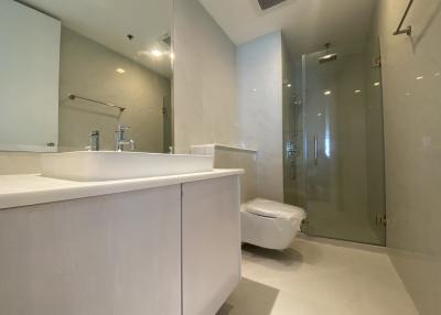 Modern bathroom with glass shower and white vanity