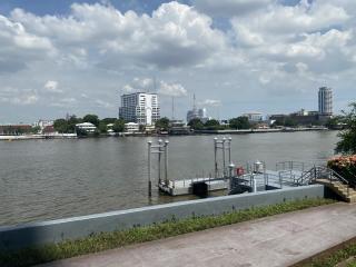Riverfront view with docking area and city skyline