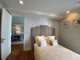 Cozy bedroom with decorative headboard and tasteful design, adjacent to dining area