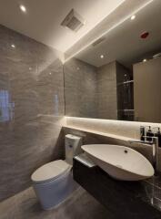 Modern bathroom with elegant fixtures and marble tiles