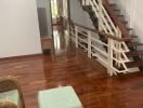 Cozy interior foyer with staircase and wooden flooring