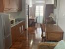 Spacious kitchen with modern appliances and wooden cabinets