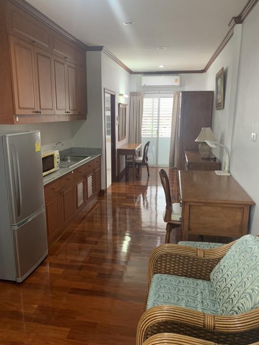 Spacious kitchen with modern appliances and wooden cabinets