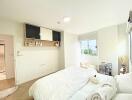 Modern bedroom with white bedding and wall-mounted TV