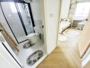 Bright modern bathroom with walk-in shower and black framed glass door