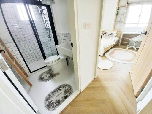 Bright modern bathroom with walk-in shower and black framed glass door