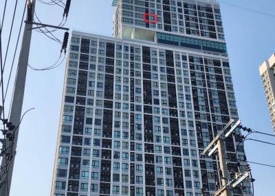 Modern High-Rise Residential Building Exterior under Clear Blue Sky