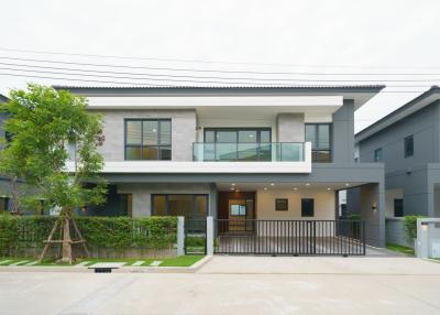 Contemporary two-story house with balcony and garage