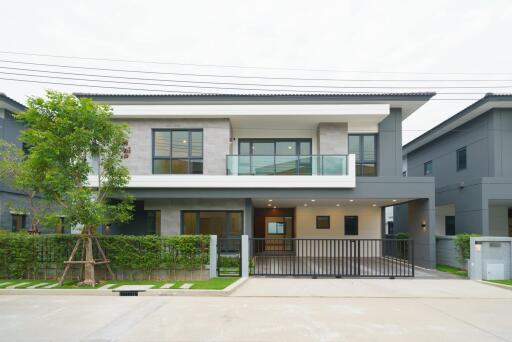 Contemporary two-story house with balcony and garage