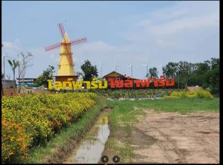 Rural landscape with windmills and a garden