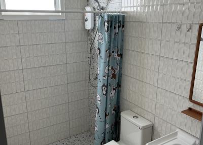 Modern bathroom with shower, toilet and bidet
