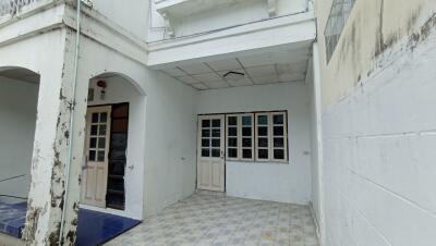 View of a building exterior showing entrance and windows