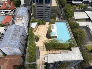 Aerial view of rooftop with swimming pool and lounge area